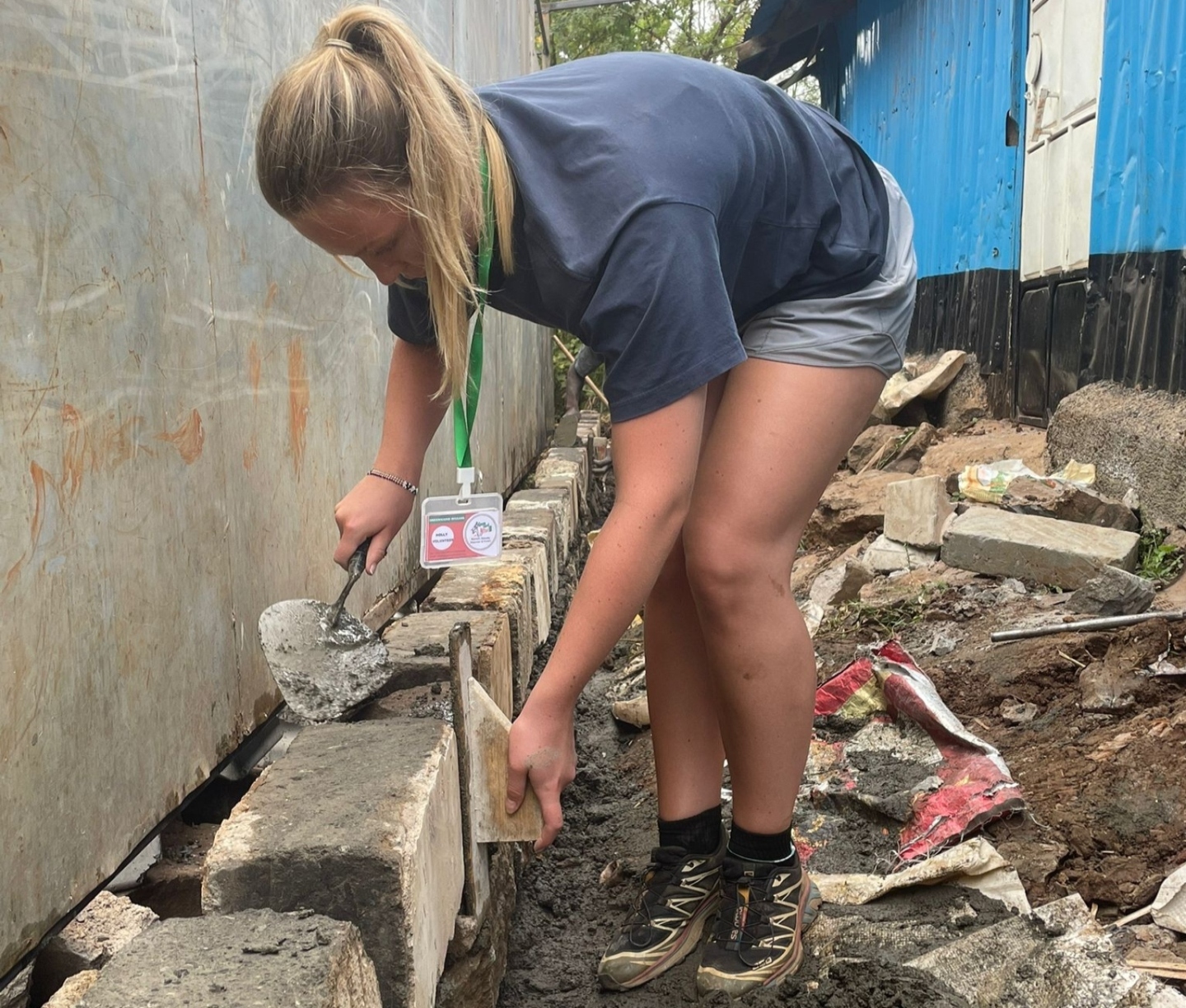 Volunteer laying blocks at Malaika School Kibra, Nairobi.