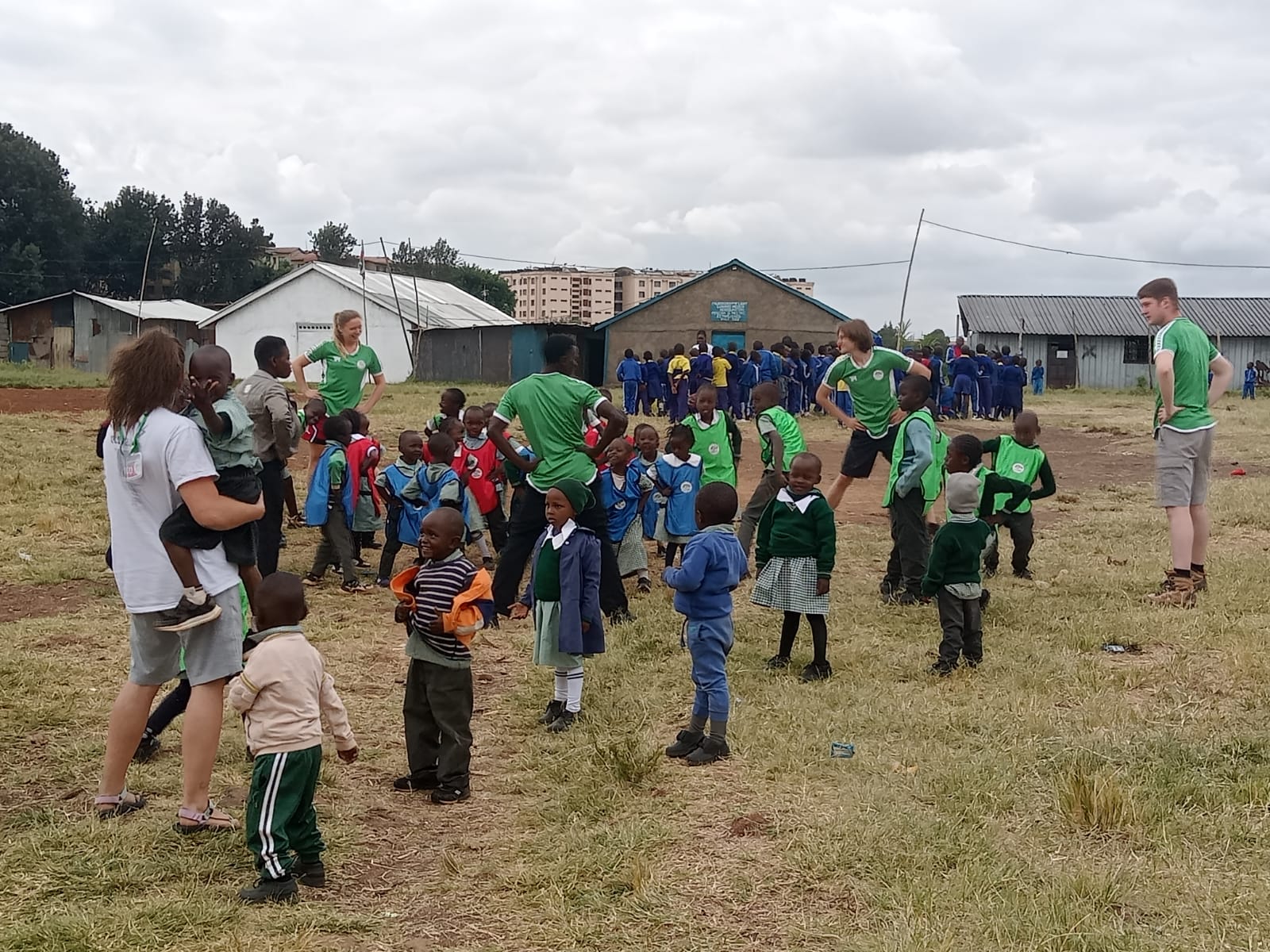 Children doing P.E. with volunteers in Malaika School Kibra, Nairobi.